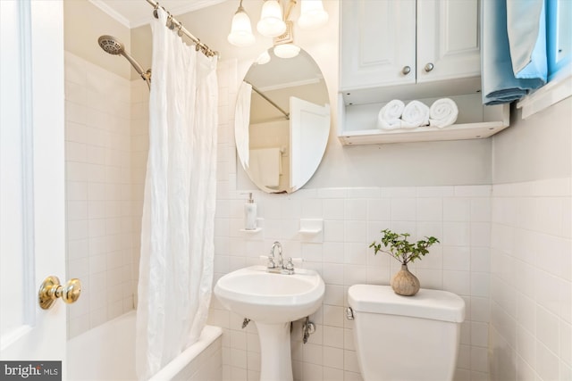 full bathroom featuring ornamental molding, tiled shower / bath, tile walls, and toilet