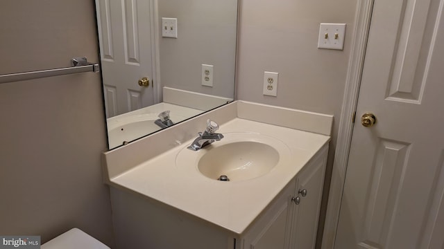 half bath with toilet and vanity