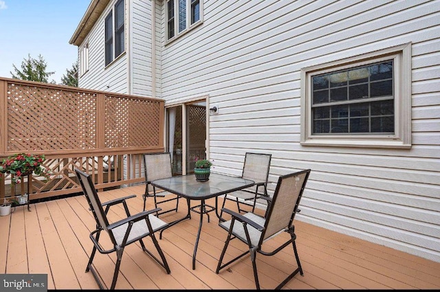 deck featuring outdoor dining area