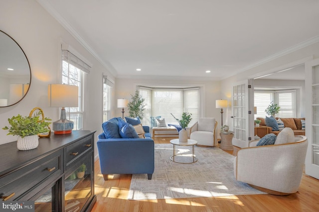 living room with light wood-style floors, recessed lighting, and ornamental molding