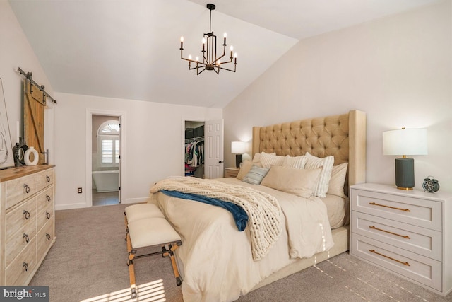 carpeted bedroom with a barn door, lofted ceiling, a walk in closet, a chandelier, and a closet