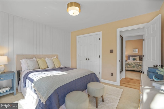 bedroom with baseboards and a closet