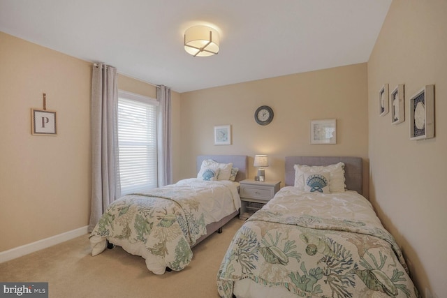 bedroom featuring baseboards and carpet flooring