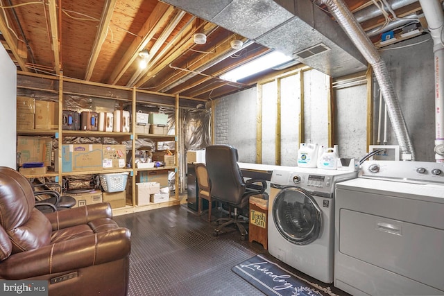 laundry area featuring laundry area, washer and clothes dryer, and visible vents