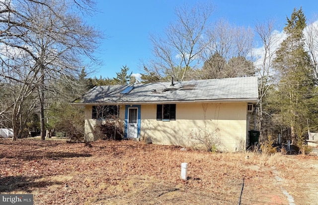 view of front of property with concrete block siding