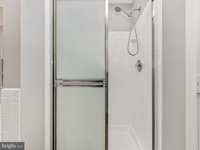 full bathroom featuring a stall shower