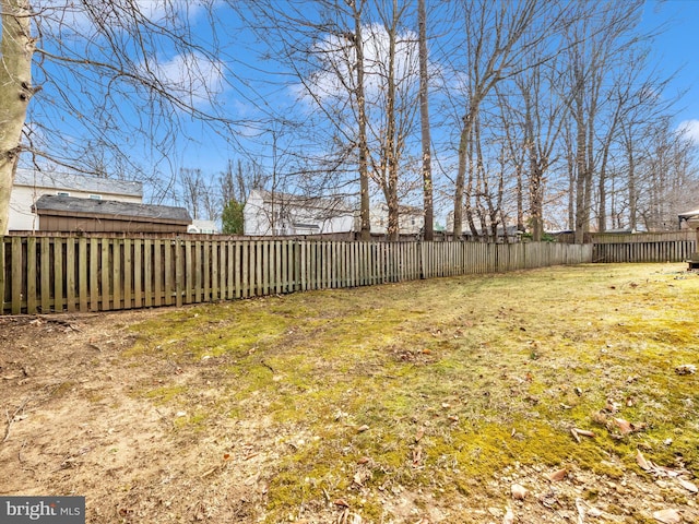 view of yard with a fenced backyard