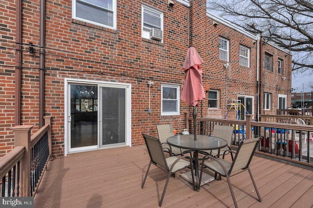 wooden terrace featuring outdoor dining space