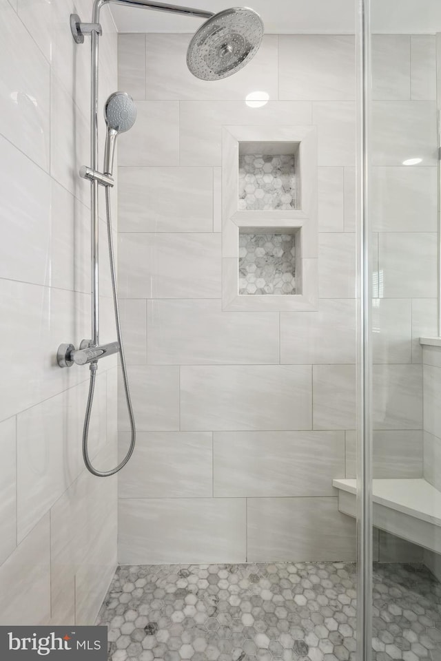 bathroom featuring a shower stall