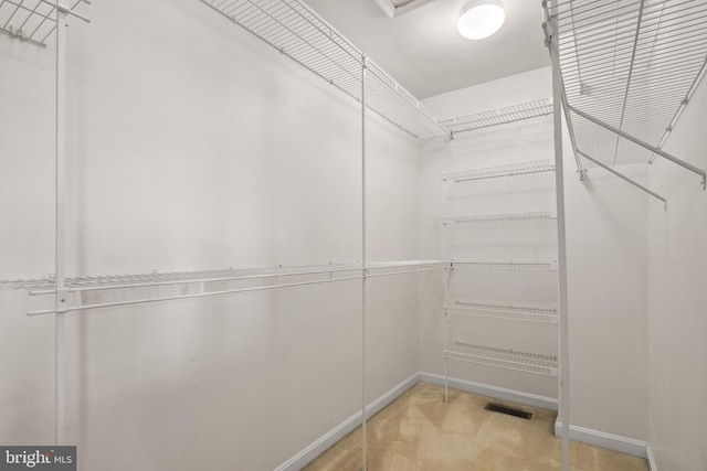 walk in closet with visible vents