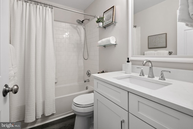 full bathroom with vanity, toilet, wood finished floors, and shower / tub combo with curtain