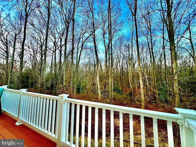 deck featuring a view of trees