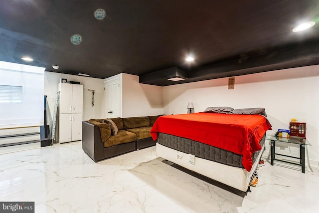 bedroom featuring recessed lighting and marble finish floor