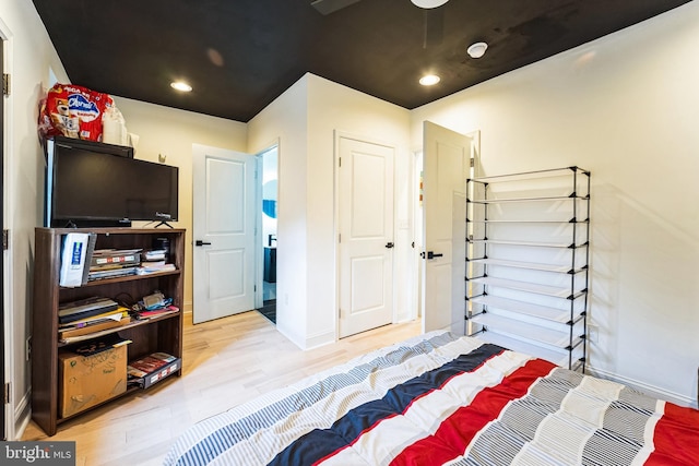 bedroom with recessed lighting, baseboards, and wood finished floors