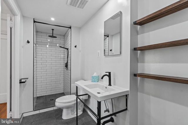 full bathroom with tile patterned flooring, visible vents, a shower stall, and toilet