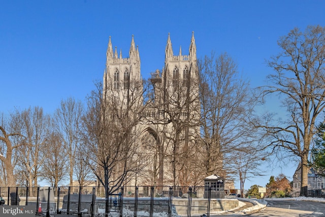 view of building exterior with fence