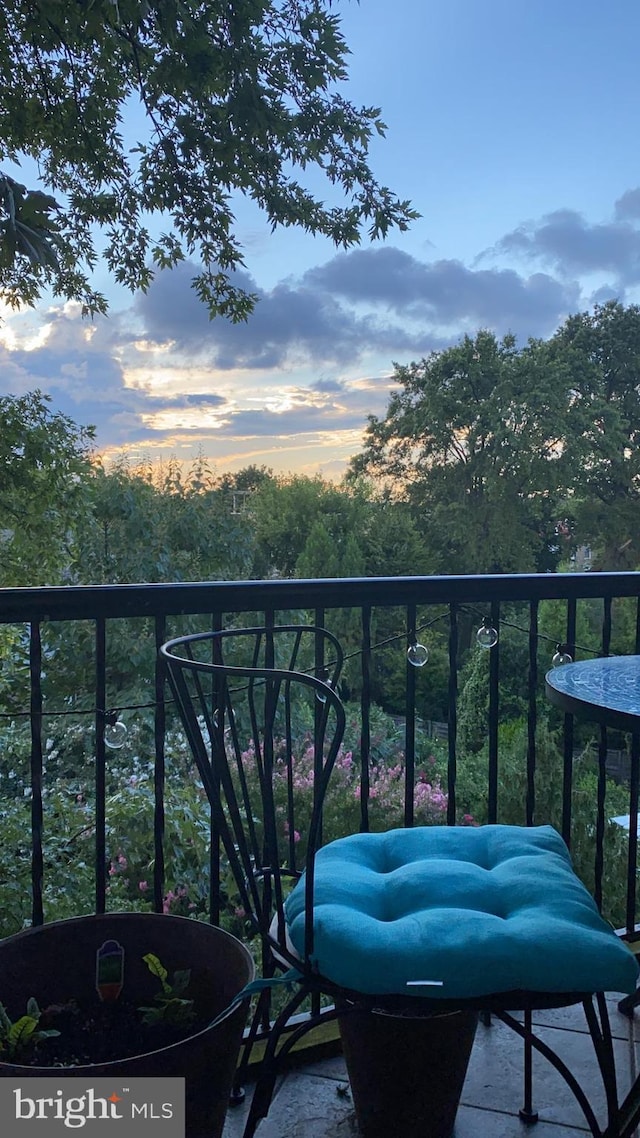 view of balcony at dusk