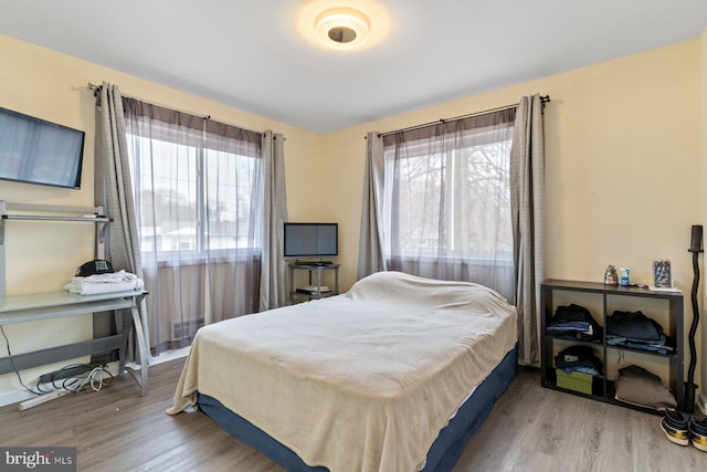 bedroom featuring wood finished floors