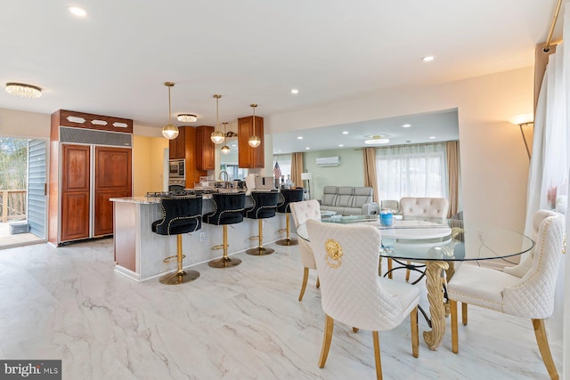 dining area with marble finish floor, a wall mounted air conditioner, and recessed lighting