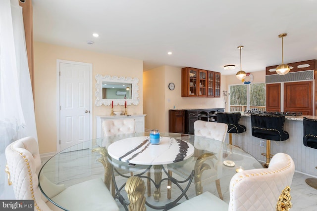 dining space featuring recessed lighting