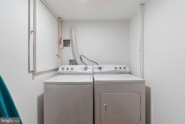 laundry area with washing machine and dryer and laundry area