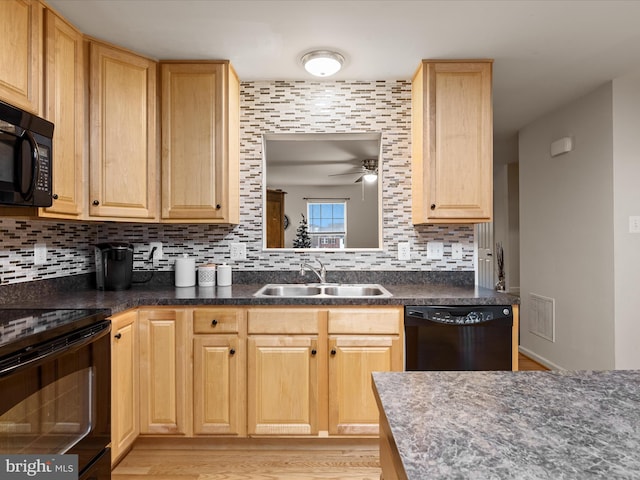 125 Monticello Sq, Winchester, VA 22602 - kitchen with decorative backsplash, light brown cabinets, black appliances, and a sink