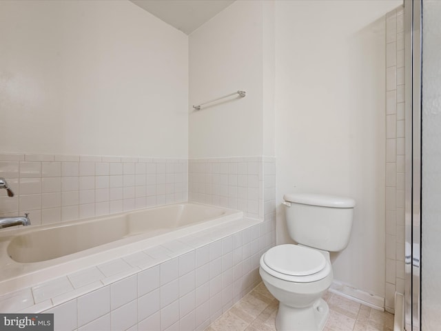 125 Monticello Sq, Winchester, VA 22602 - bathroom with tile patterned floors, toilet, and a garden tub