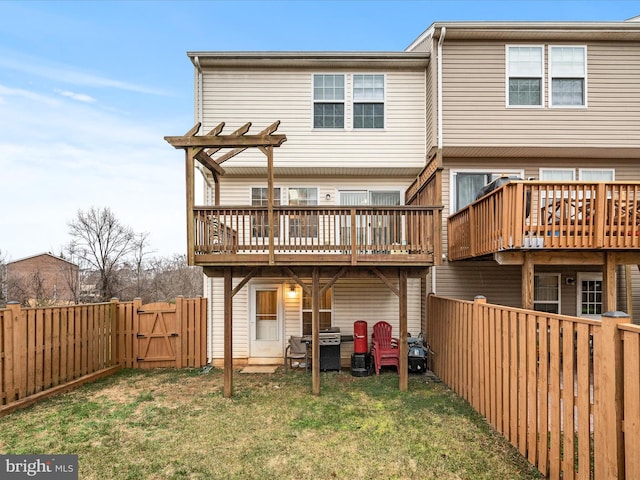 125 Monticello Sq, Winchester, VA 22602 - back of house with a yard, a deck, a fenced backyard, and a gate