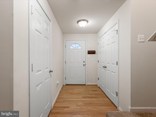 125 Monticello Sq, Winchester, VA 22602 - doorway with light wood-type flooring and baseboards
