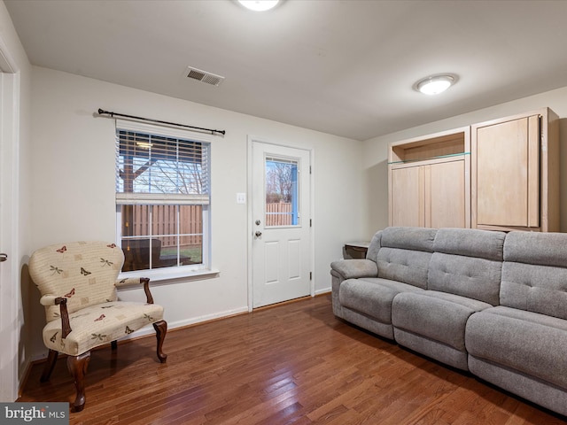 125 Monticello Sq, Winchester, VA 22602 - living area featuring wood finished floors, visible vents, and baseboards