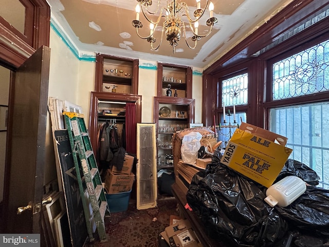 misc room with a notable chandelier