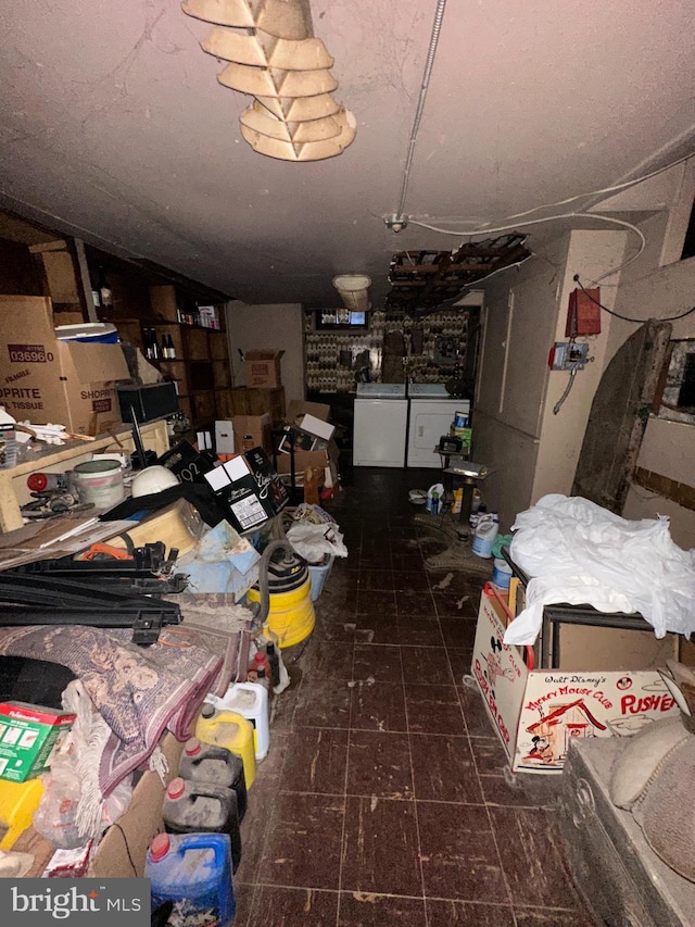 miscellaneous room featuring washer and dryer and vaulted ceiling