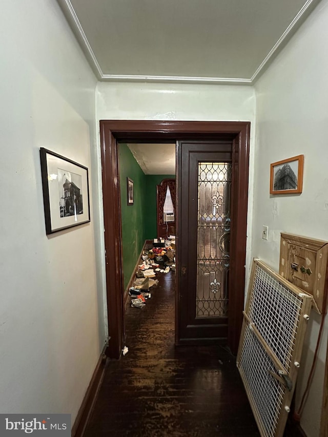 hallway with baseboards, dark wood-style flooring, and crown molding