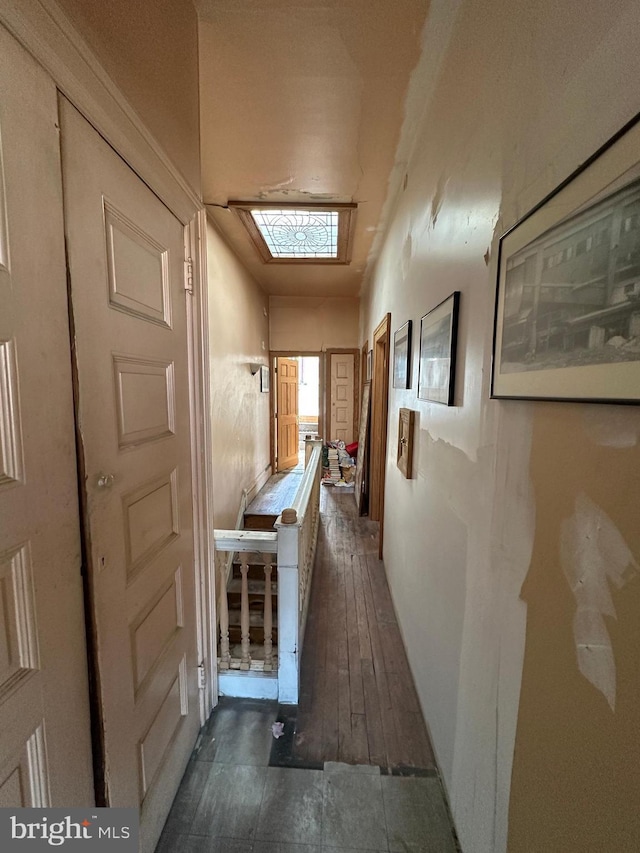 corridor featuring hardwood / wood-style floors