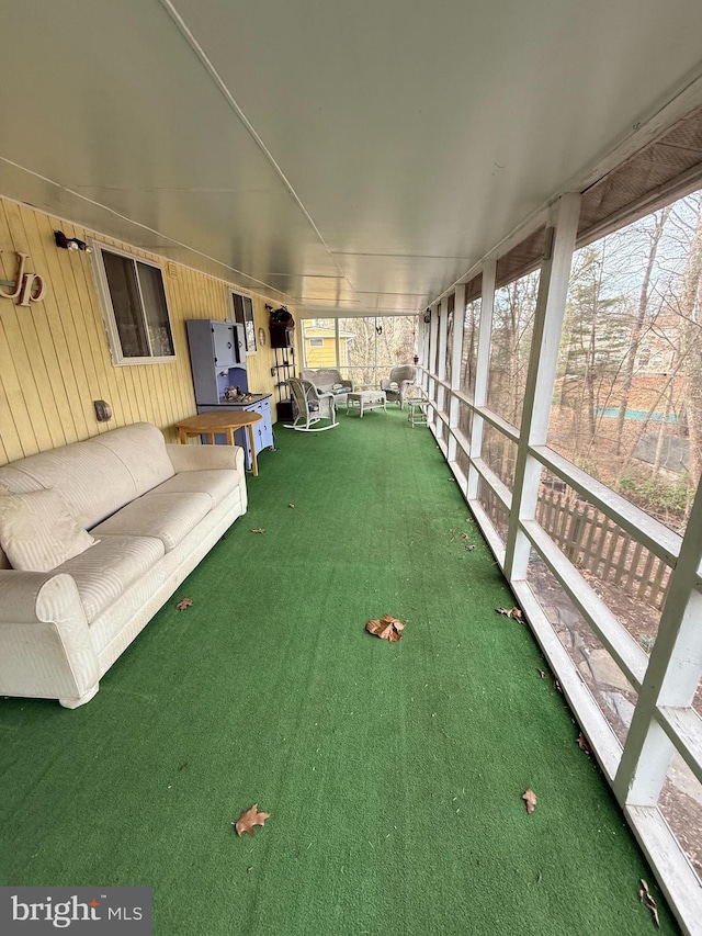 unfurnished sunroom featuring a healthy amount of sunlight