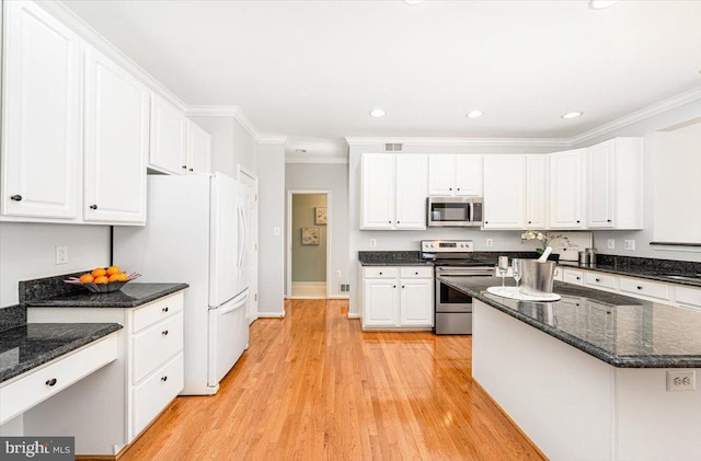 kitchen featuring white cabinetry, light wood-style flooring, appliances with stainless steel finishes, and ornamental molding