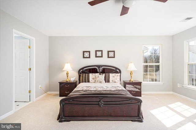 bedroom with visible vents, baseboards, a ceiling fan, and carpet flooring