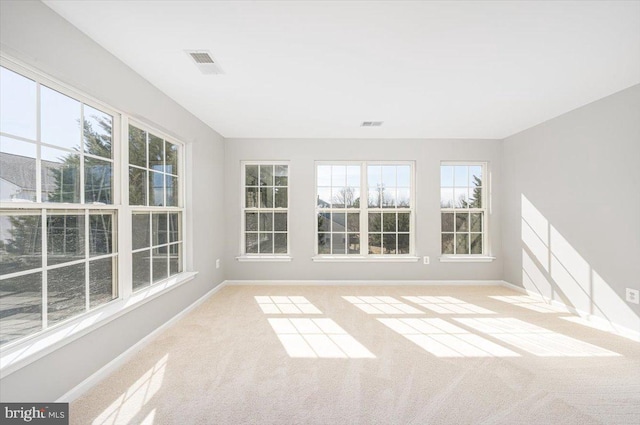 unfurnished sunroom featuring visible vents