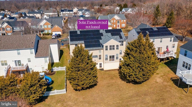 birds eye view of property with a residential view