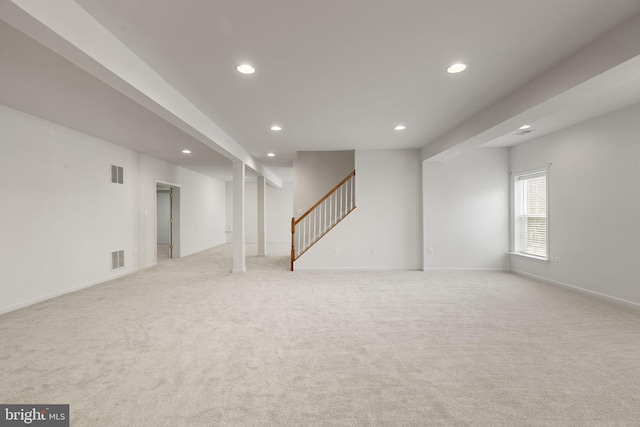 basement featuring stairs, visible vents, recessed lighting, and baseboards