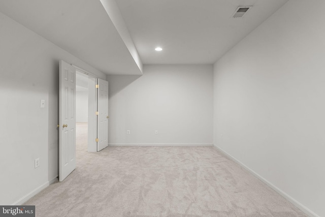 finished basement with recessed lighting, visible vents, carpet flooring, and baseboards