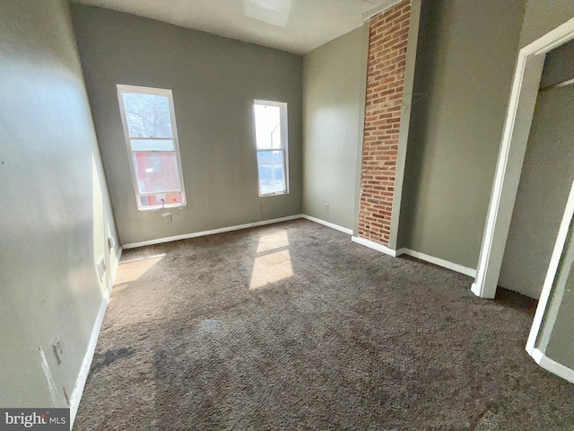 unfurnished bedroom with carpet floors and baseboards