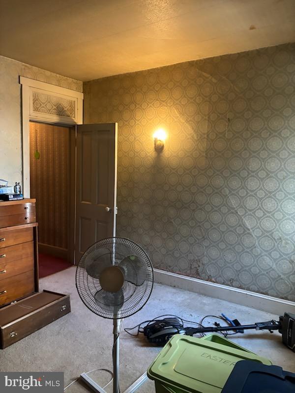 bedroom with wallpapered walls