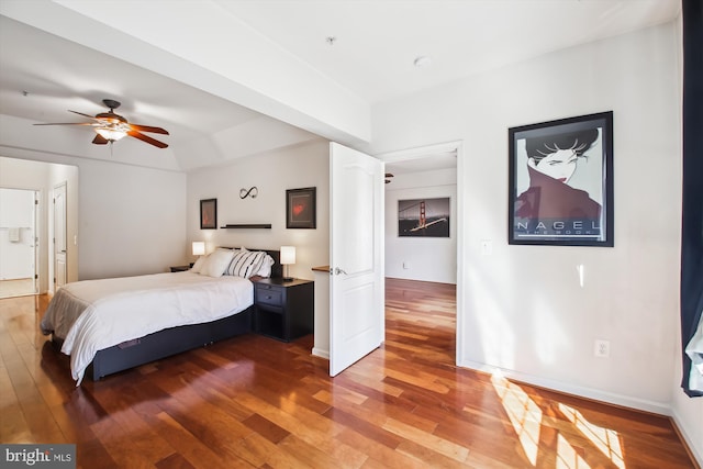 bedroom featuring hardwood / wood-style flooring and baseboards