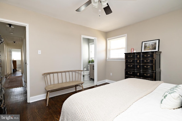 bedroom with a ceiling fan, connected bathroom, baseboards, and wood finished floors