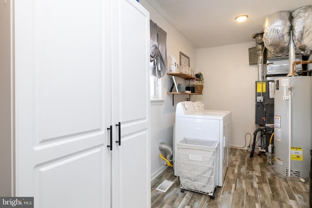 utility room featuring separate washer and dryer and gas water heater