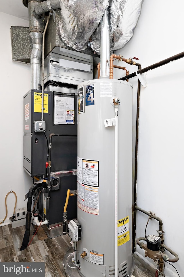 utility room featuring gas water heater