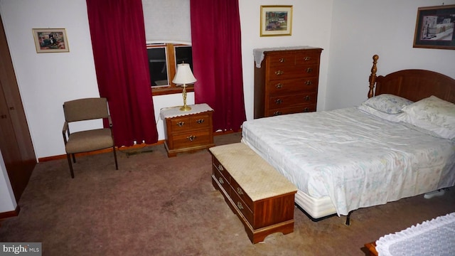 bedroom featuring carpet flooring and baseboards