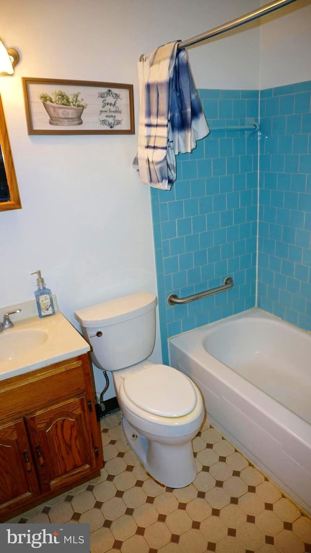 bathroom featuring vanity, shower / tub combination, toilet, and tile patterned floors