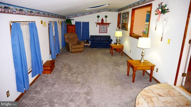 carpeted living room featuring lofted ceiling